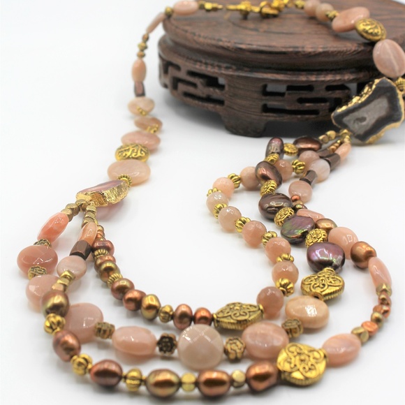 Multi strand asymmetric pearl and gem necklace